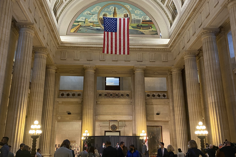 Cleveland City Hall atrium with crowd at press conference.